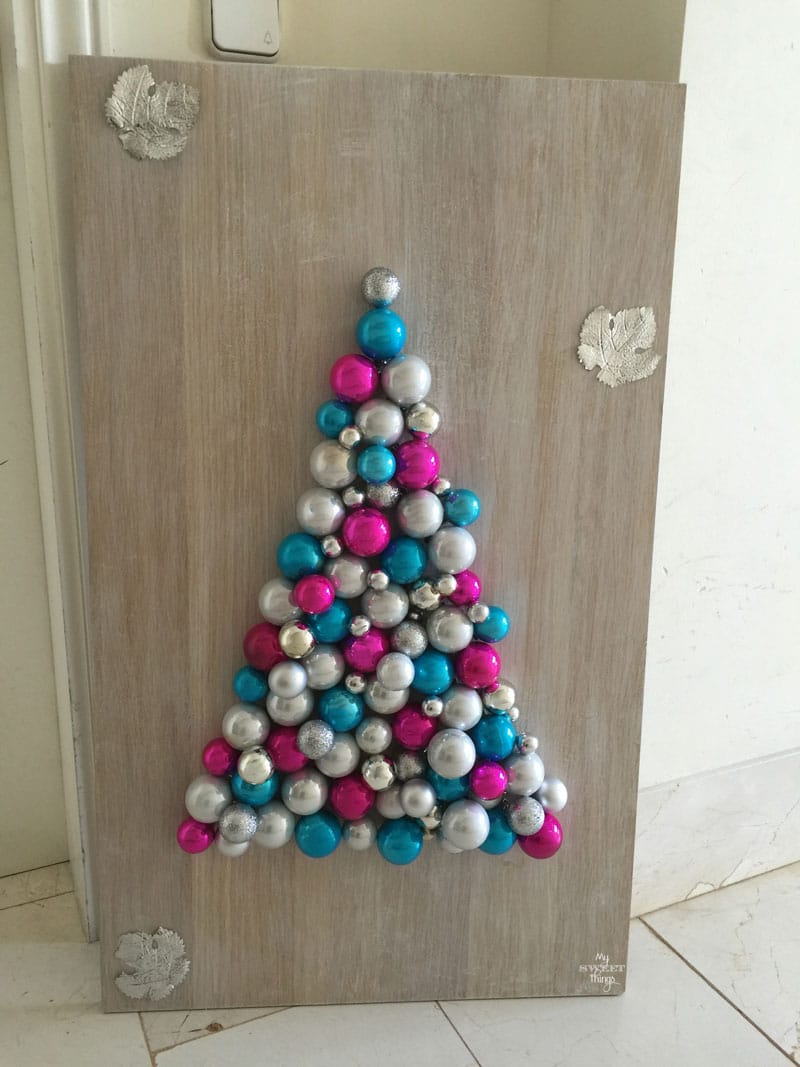 Take some scrap wood and Christmas baubles to make an alternative Christmas tree | DIY | Via www.sweethings.net