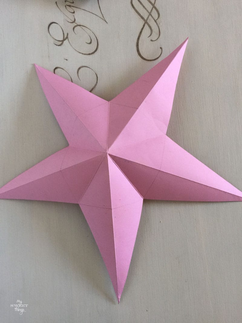 Tutorial on how to make faux metal stars out of common household items and silver spray paint