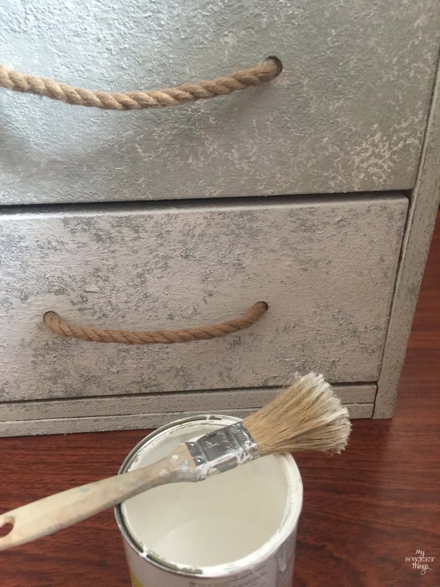 Coastal filing cabinet makeover using Saltwash for a coastal and weathered look with rope as handles