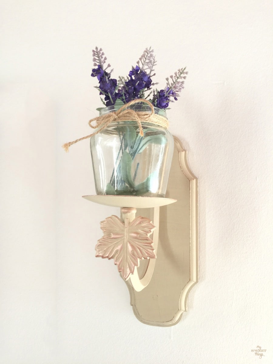 Light wall sconce repurposed into candle wall sconce with just some paint and an empty jar · Via www.sweethings.net
