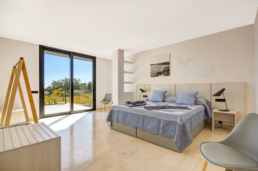 Modern property with sea views which has a bright and airy look · Large bedroom with sea views · Via www.sweethings.net