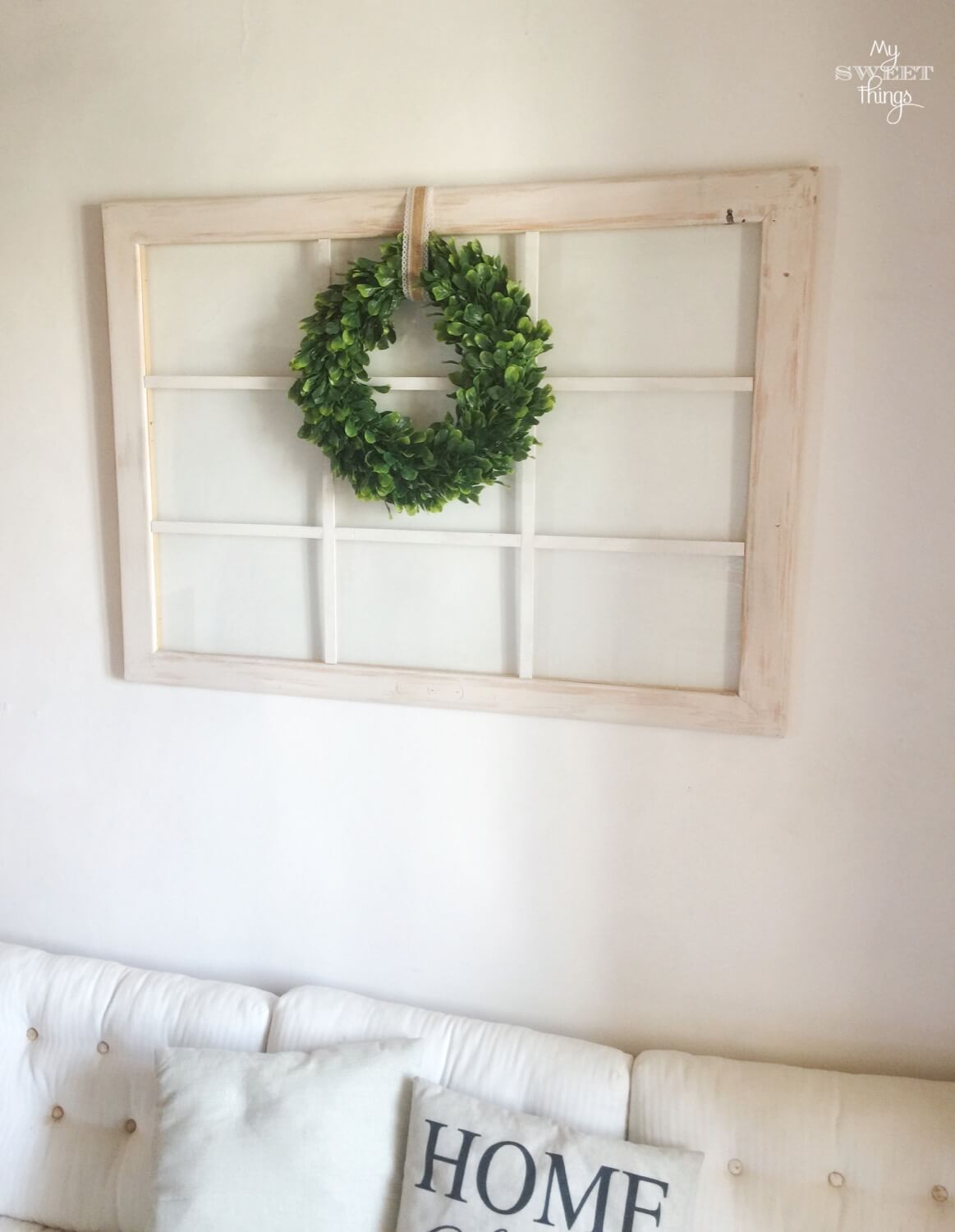 Old windows repurposed into home decor with boxwood wreath · Via www.seethings.net