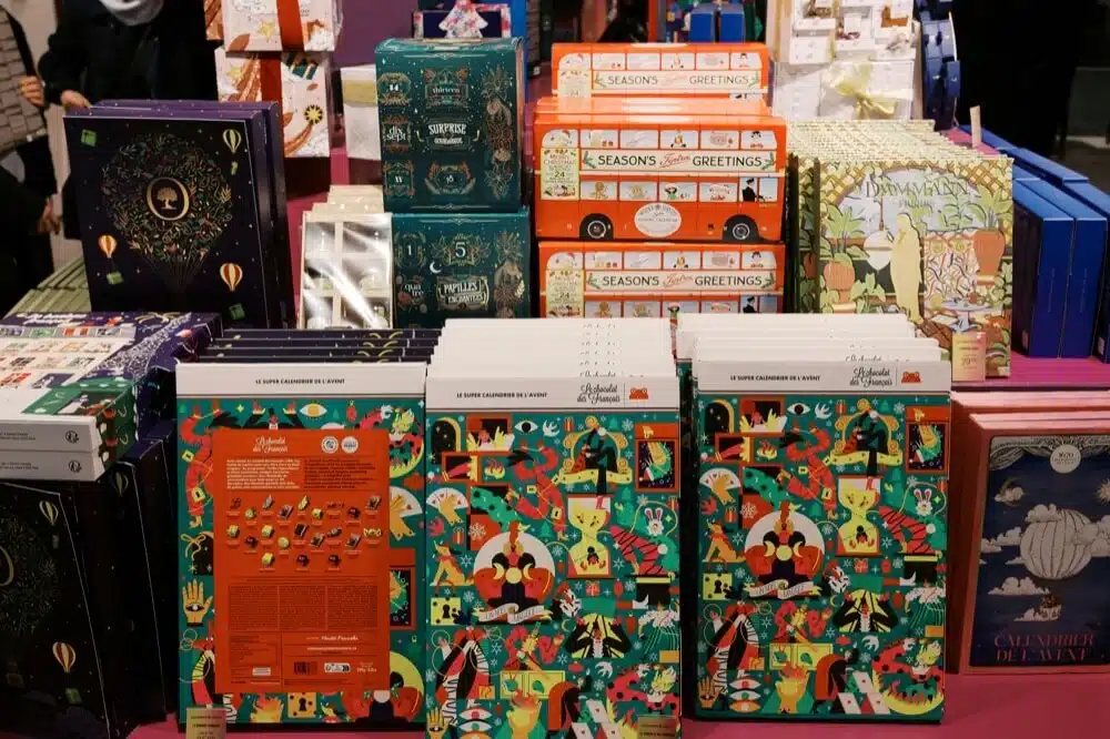 A bunch of books and boxes on a table