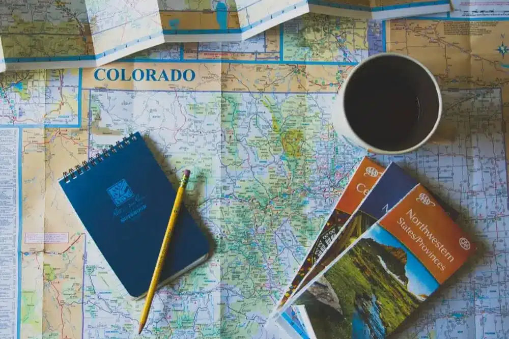 Leaflets and pencil on a Colorado map